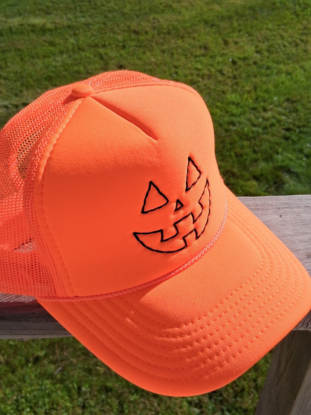 Neon Orange Jack-O-Lantern Face Trucker Hat